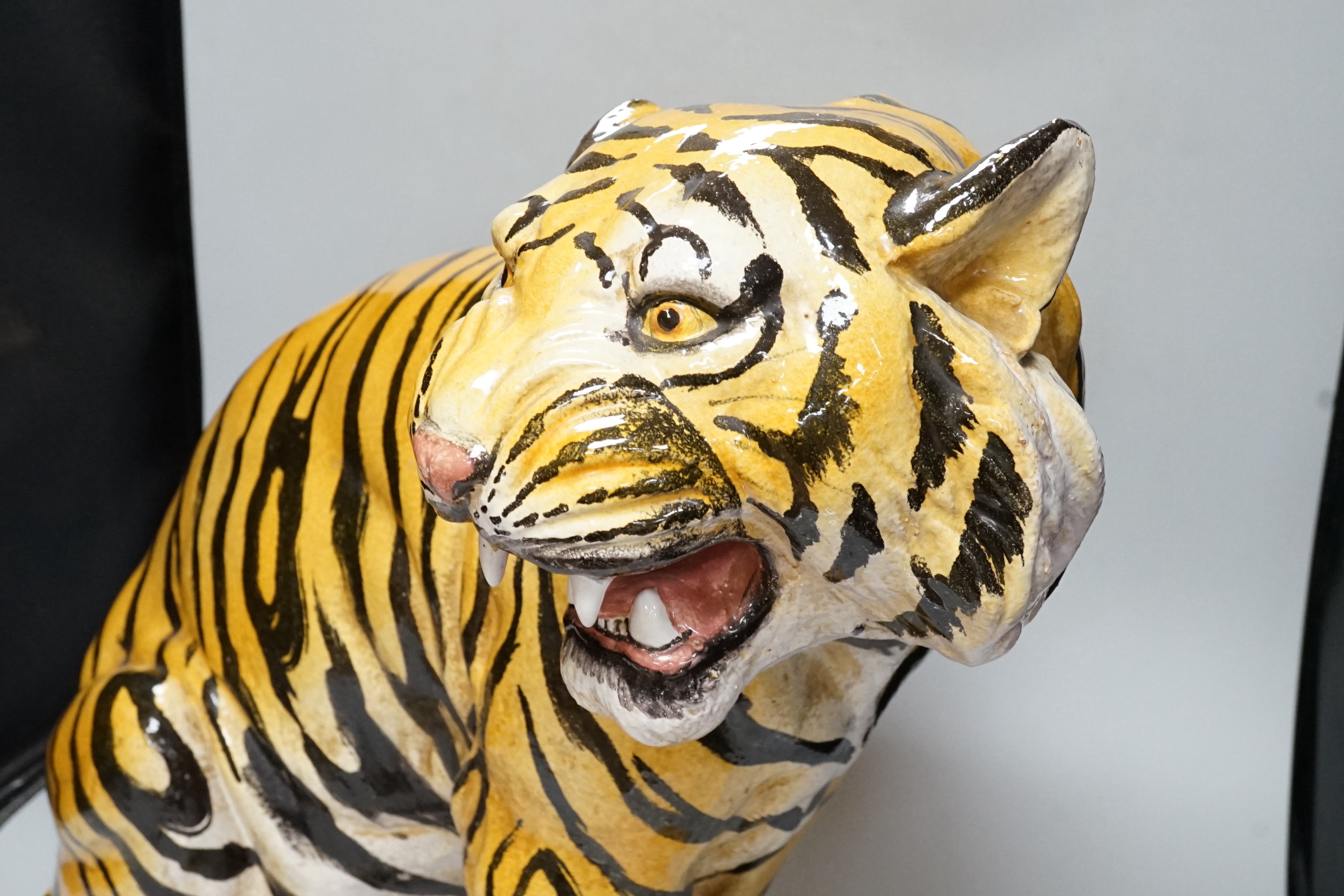 A large Italian painted maiolica model of a tiger, 49cm